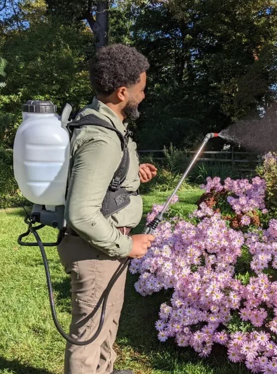 Deer Solution guy spraying repellent